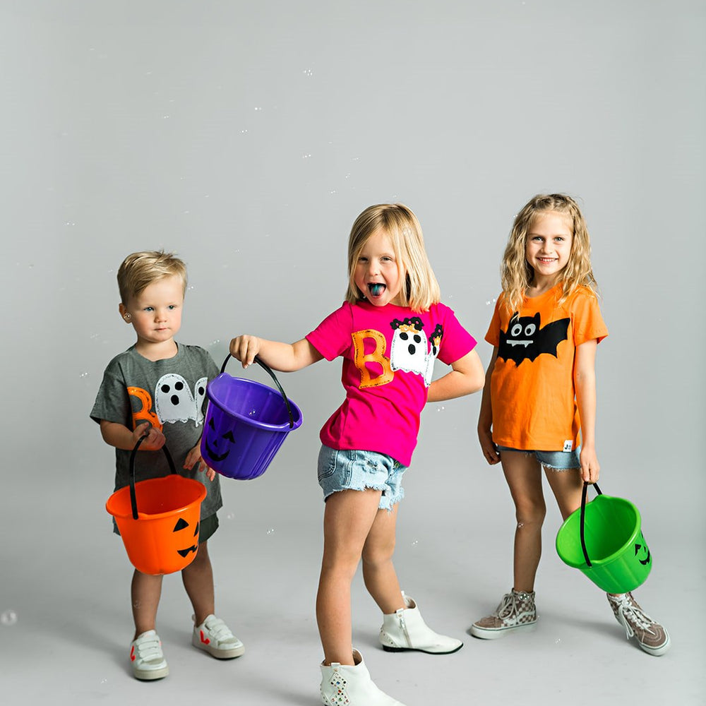 Kids dressed in the Halloween collections tees. Grab yours today!